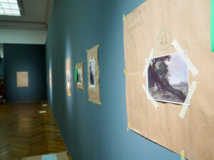 For each work, a full-size "dummy" is hung first.